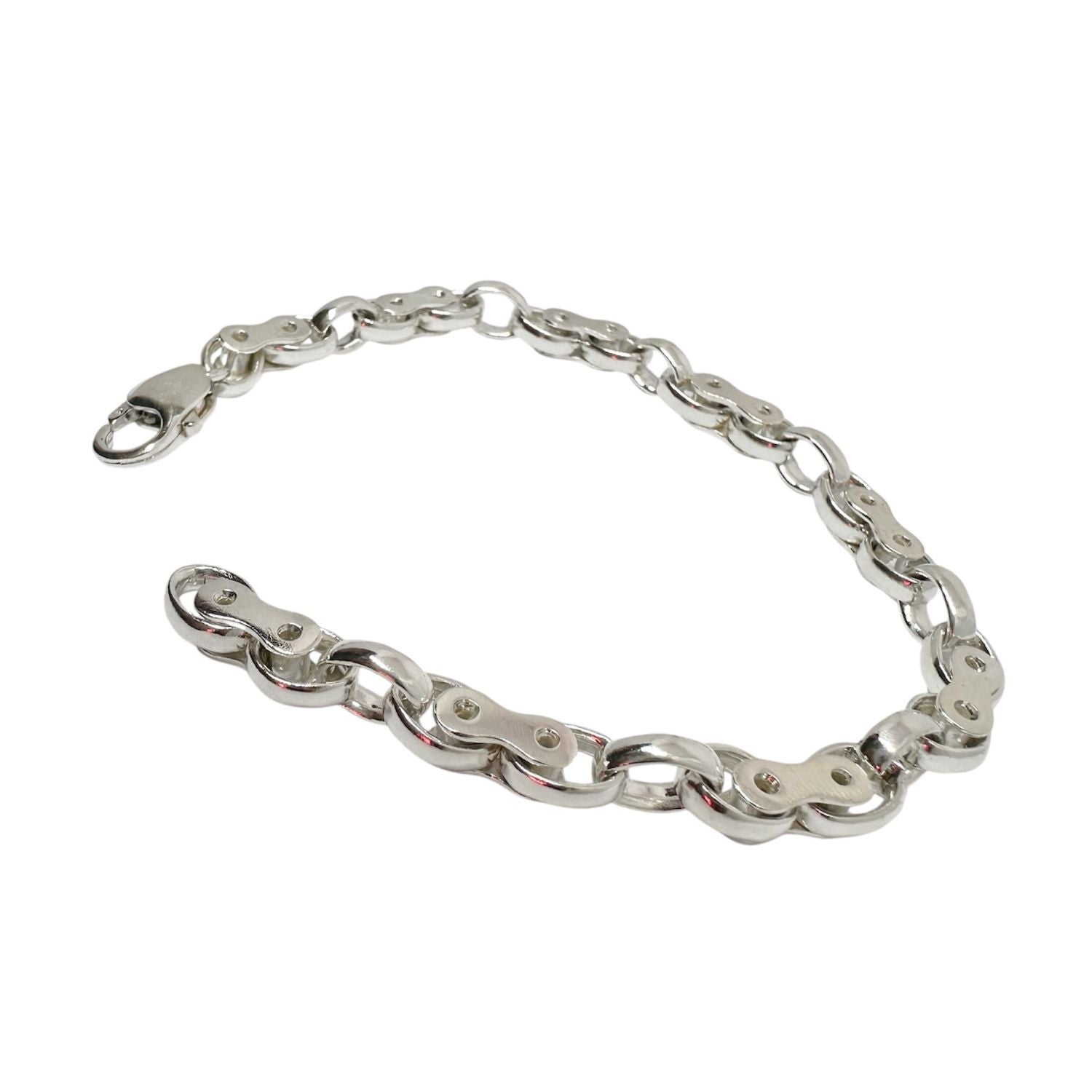 Handcrafted sterling silver biker link bracelet with alternating oval and connector links, polished finish and lobster clasp, shown against a neutral background.