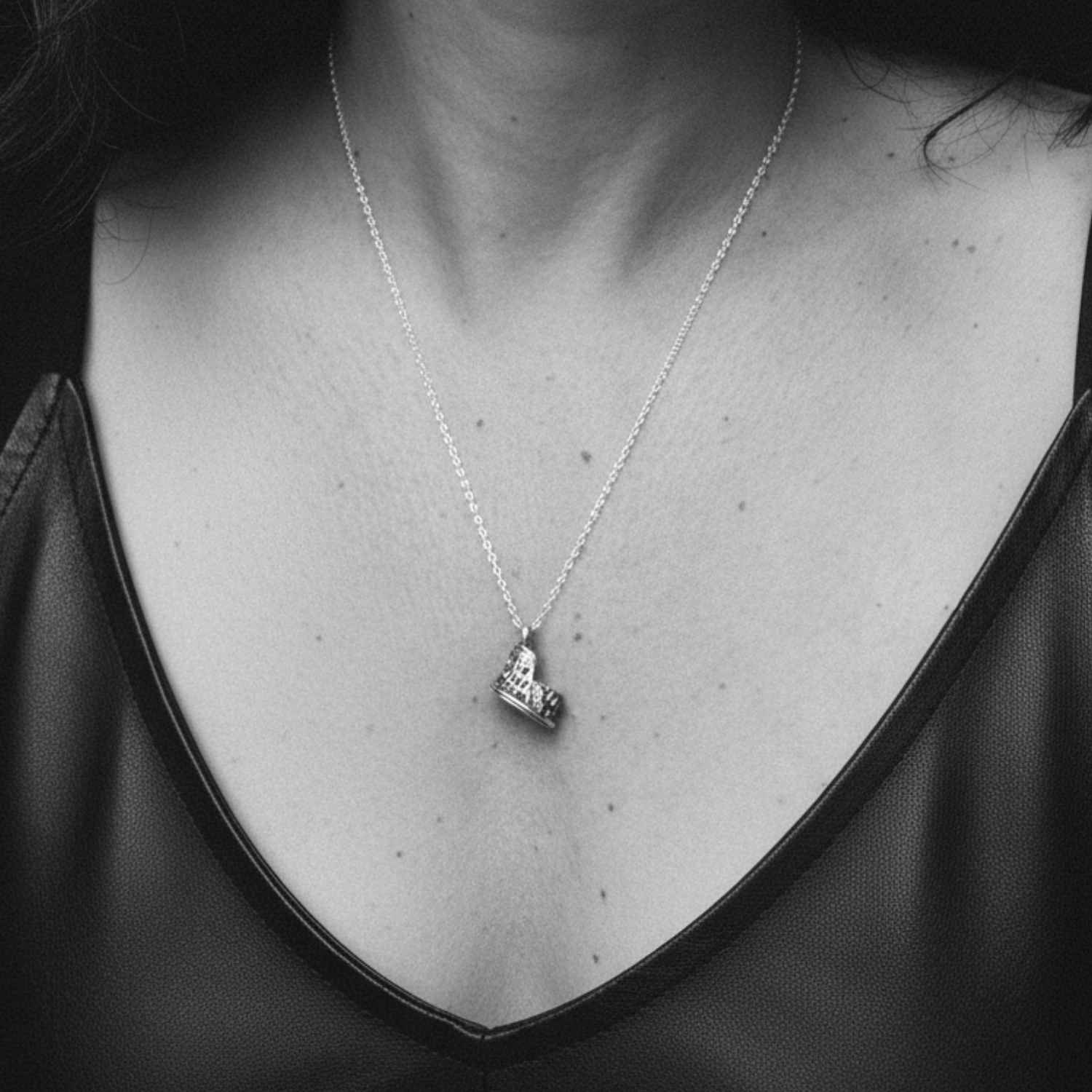 Model wearing handmade Colosseum pendant necklace in sterling silver 925 – Tg-Jewellery by Tamara Gervasio, Cornwall
