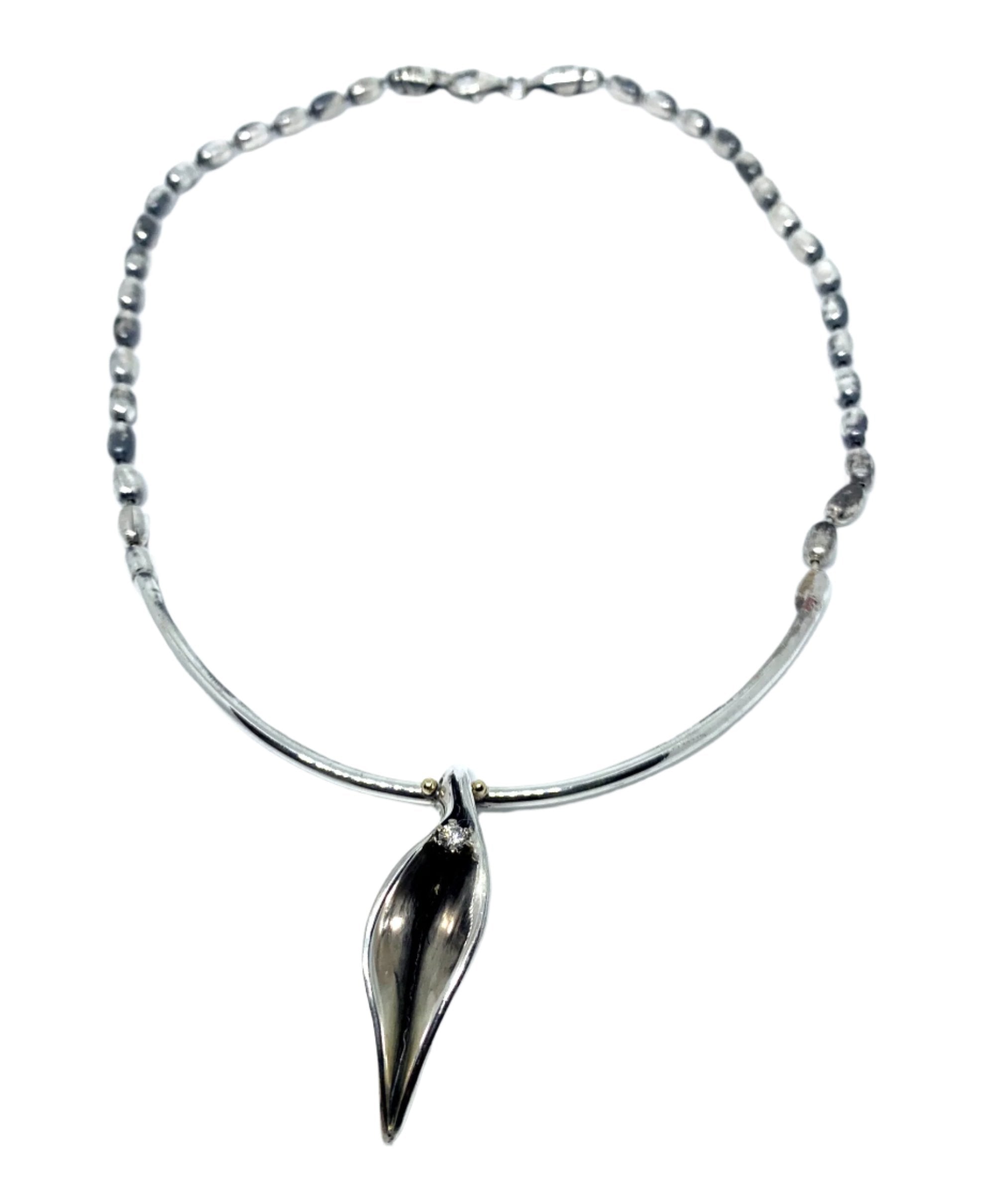 Erotika necklace in sterling silver 925 — full view of sculptural pendant with 3mm diamond set in 18ct yellow gold, polished and oxidised finish- Tg-Jewellery By Tamara Gervasio