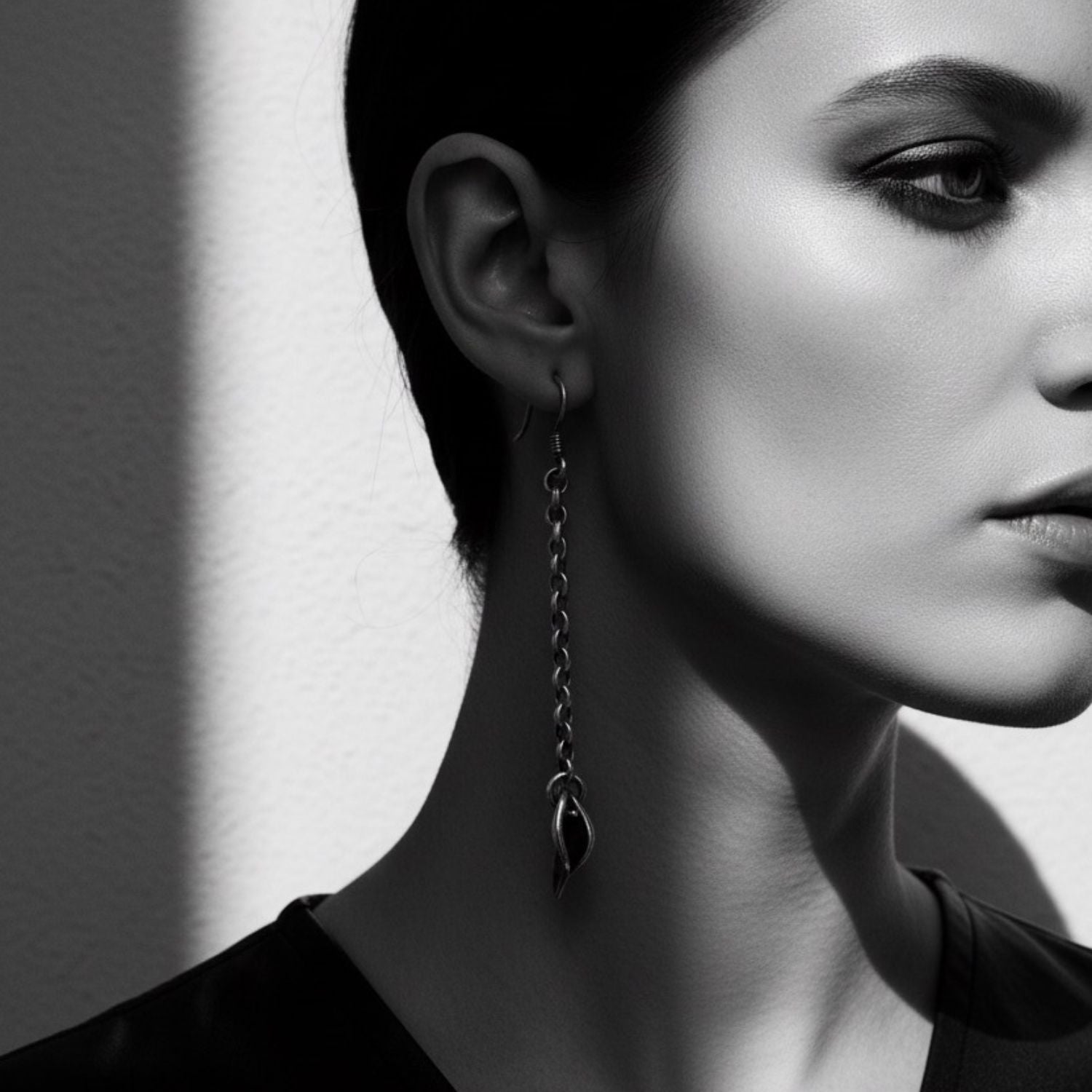 Erotika solo drop earring worn — 7.1cm sterling silver 925 statement earring with 9ct yellow gold detail, handmade in Cornwall