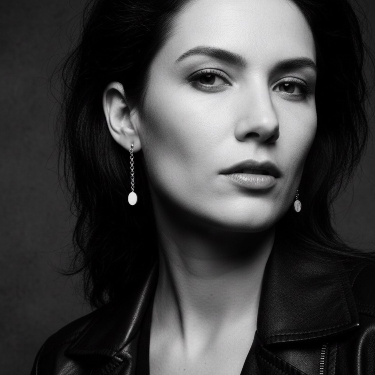 Model wearing sterling silver 925 oval drop earrings, 4.6cm length, showing elegant movement and scale