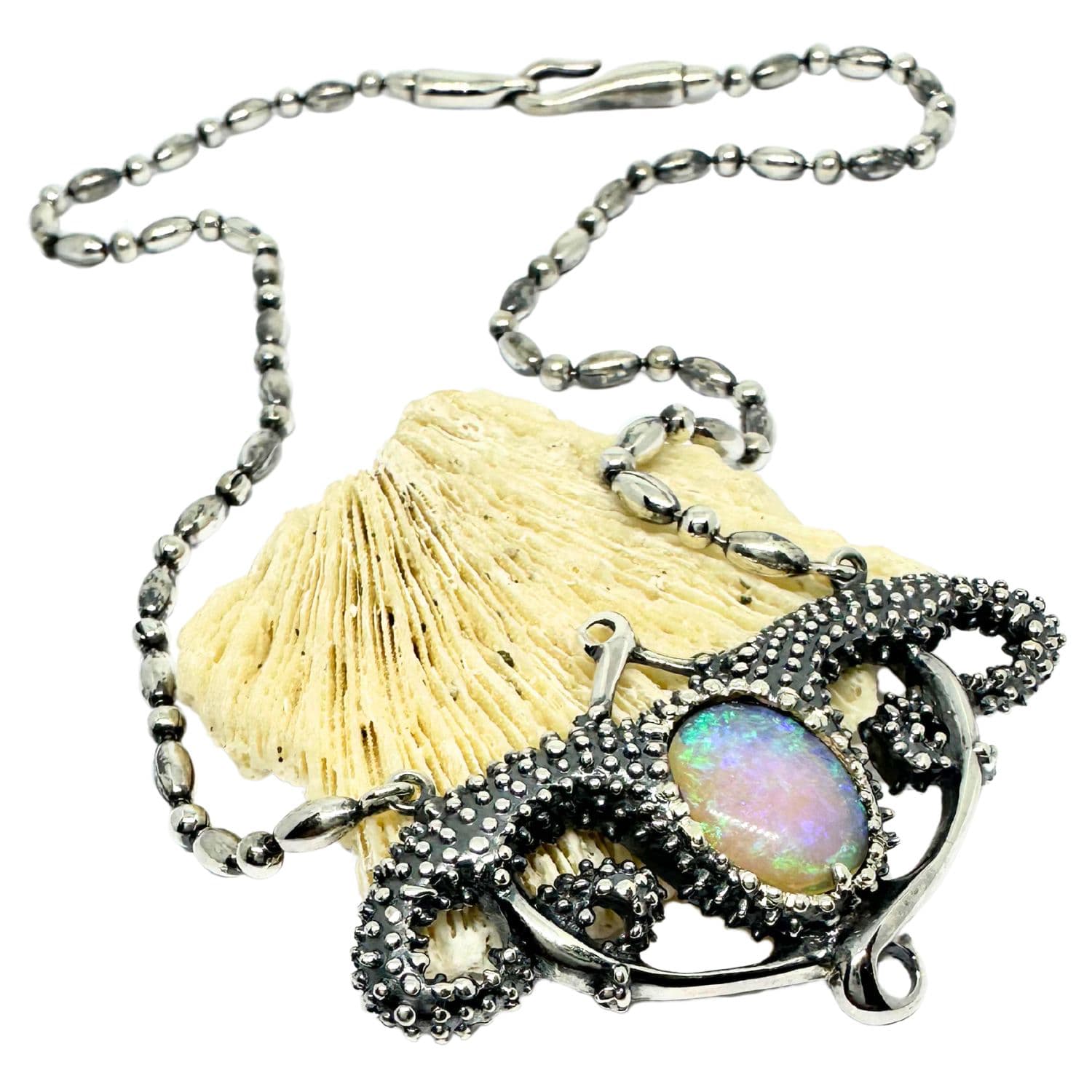 Close-up of Sea Urchin Pendant – sterling silver 925 with fire opal, UK Hallmarked, 55.65 × 40mm sculptural form