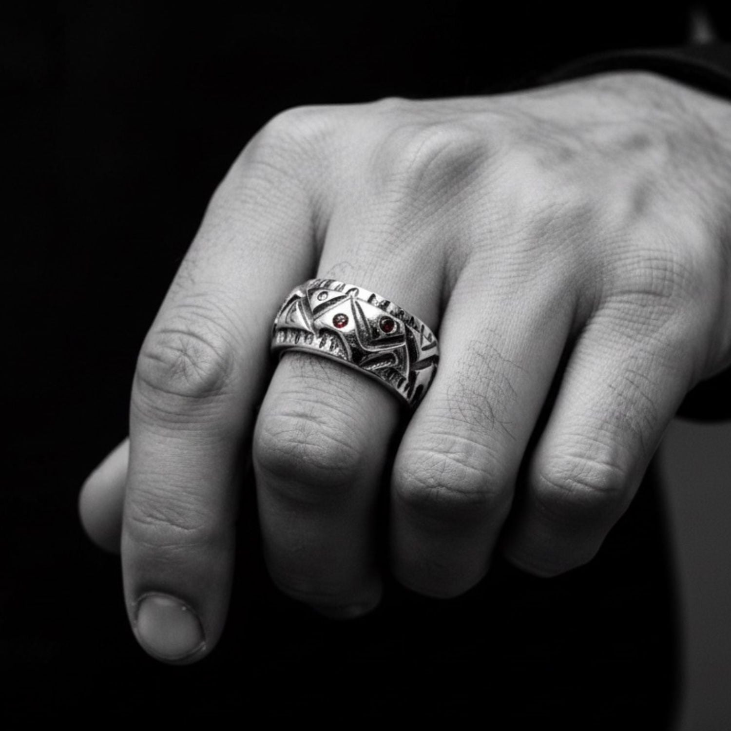 Model wearing sterling silver 925 abstract men's ring with ruby gemstones, bold sculptural presence on hand