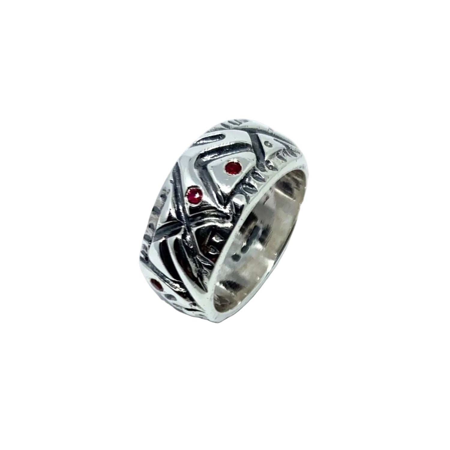 Close-up showing asymmetric form and seven 1.5mm ruby gemstone settings - Tg-Jewellery By Tamara Gervasio
