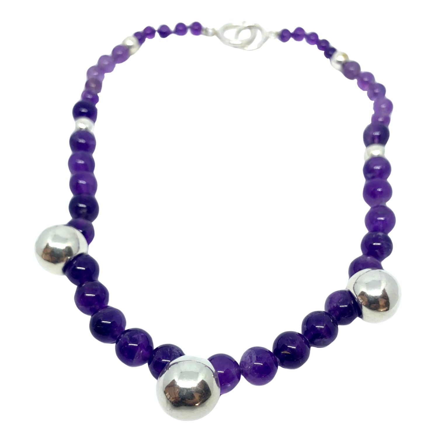 Close-up of natural amethyst gemstones and sterling silver 925 beads on silk thread – TG-Jewellery