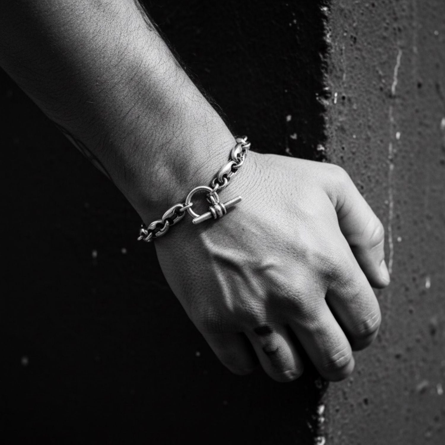 Model wearing sterling silver 925 Anchor Link T-Bar Unisex Bracelet, bold anchor link chain and oxidised surface on wrist