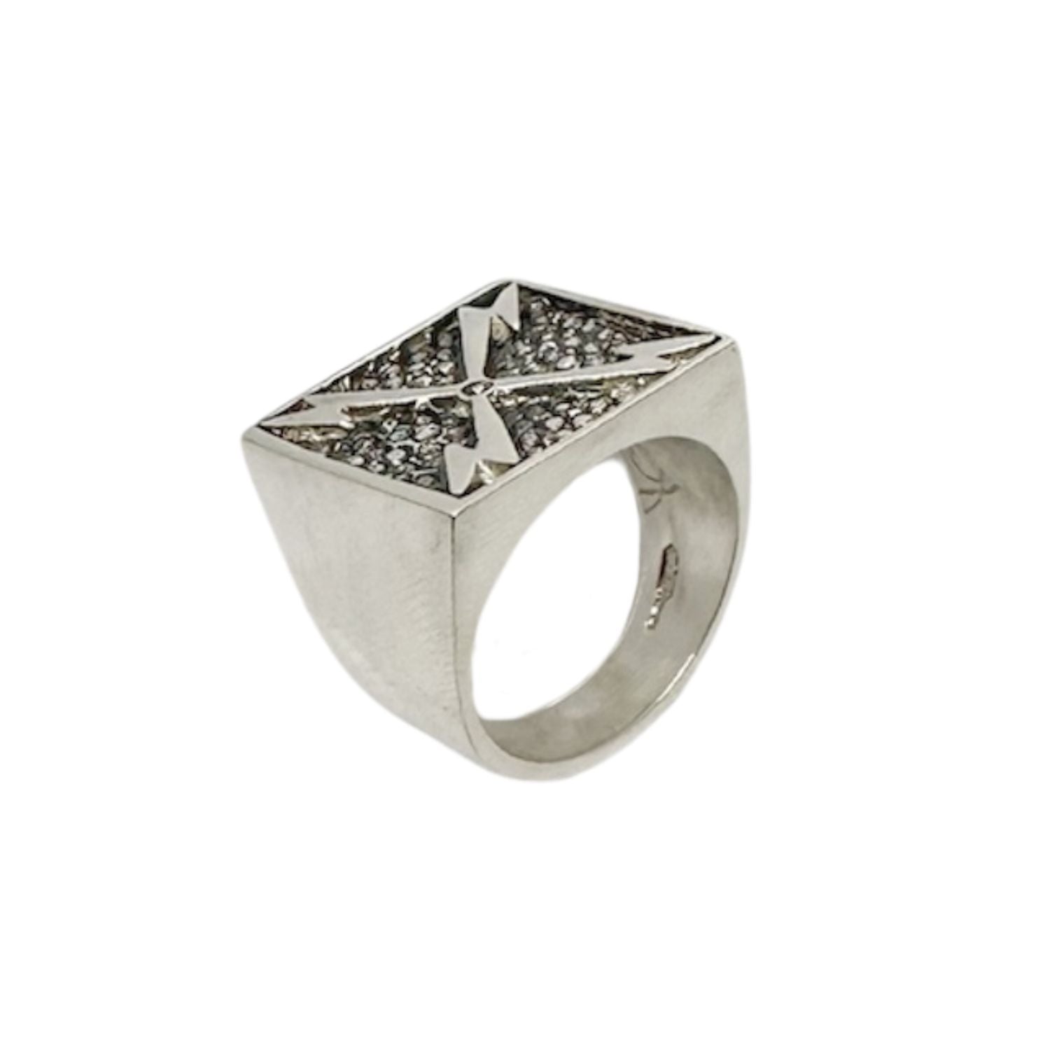Side profile showing bold sculptural presence and oxidised textured surface