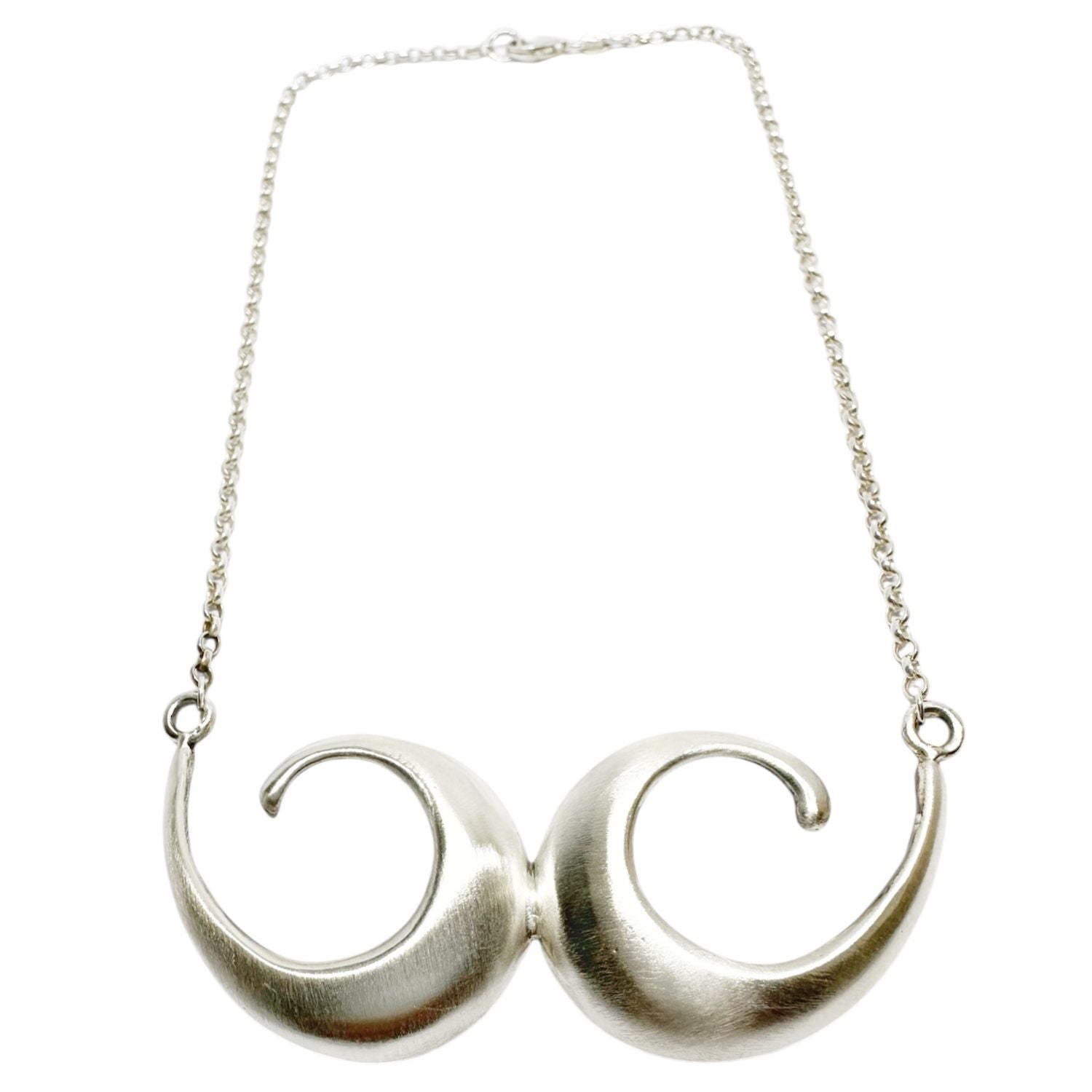 Satin polished surface detail on Conchiglia sterling silver pendant, handcrafted lost wax cast necklace UK