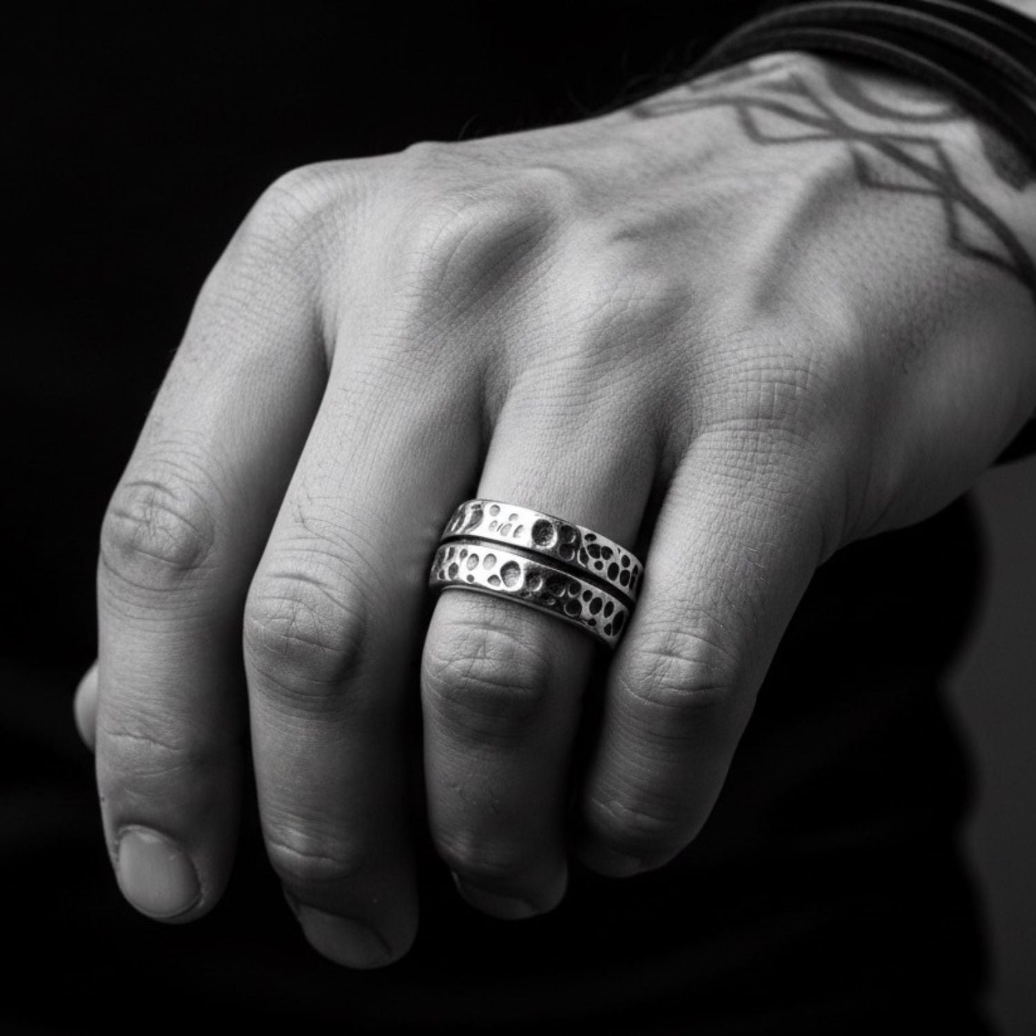 Model wearing sterling silver 925 Effect Ring with oxidised detailing, bold wide band presence on hand