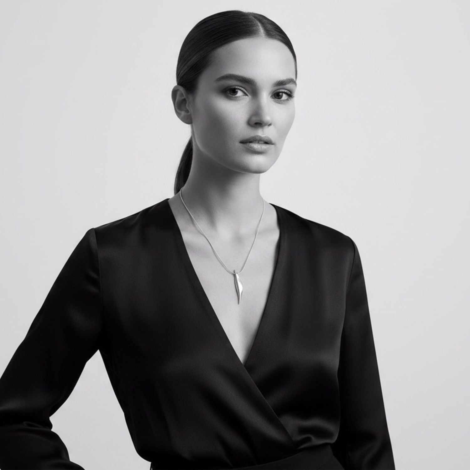 Model wearing Erotika sterling silver 925 pendant necklace with 16in snake chain – TG-Jewellery