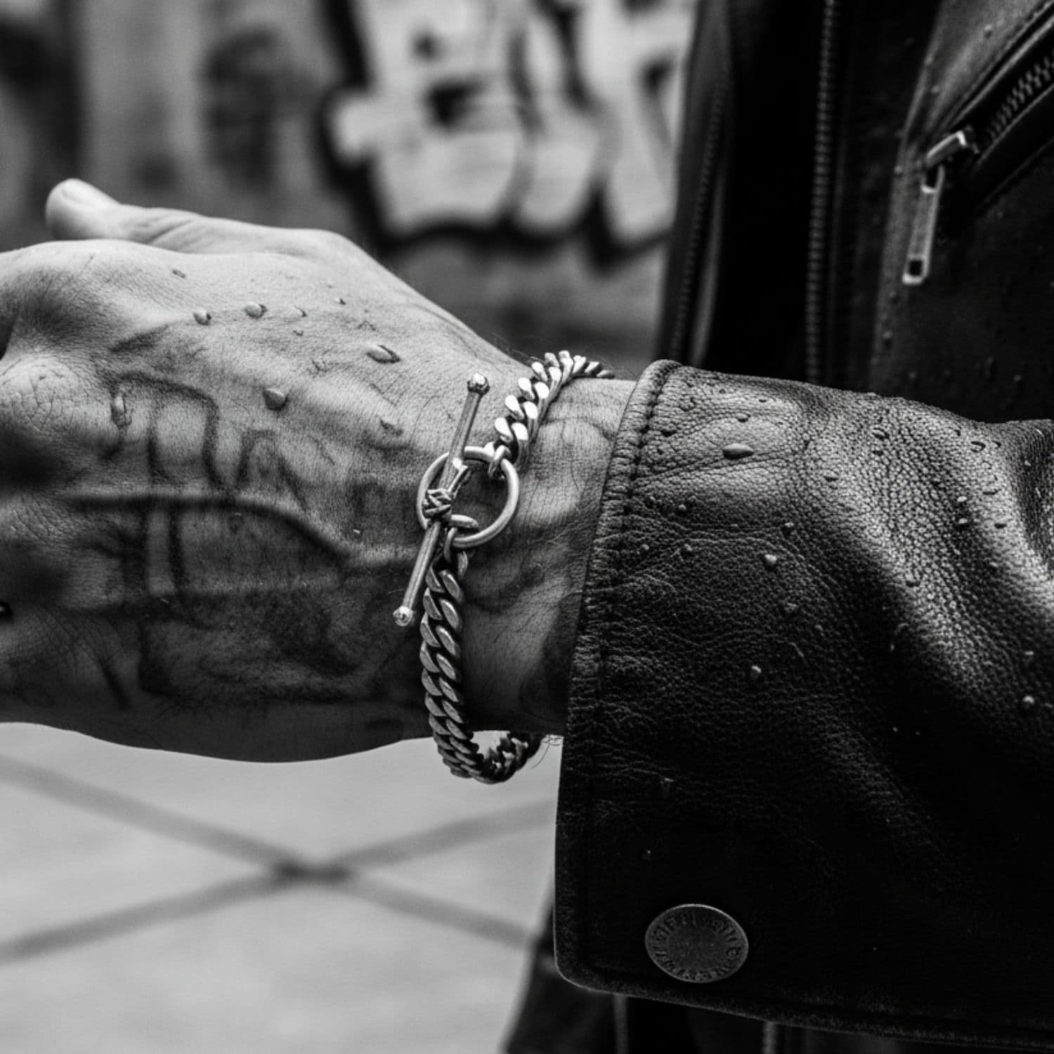 Model wearing 6mm flat curb chain bracelet with skeletal hand T-bar in sterling silver 925 – Tg-Jewellery by Tamara Gervasio