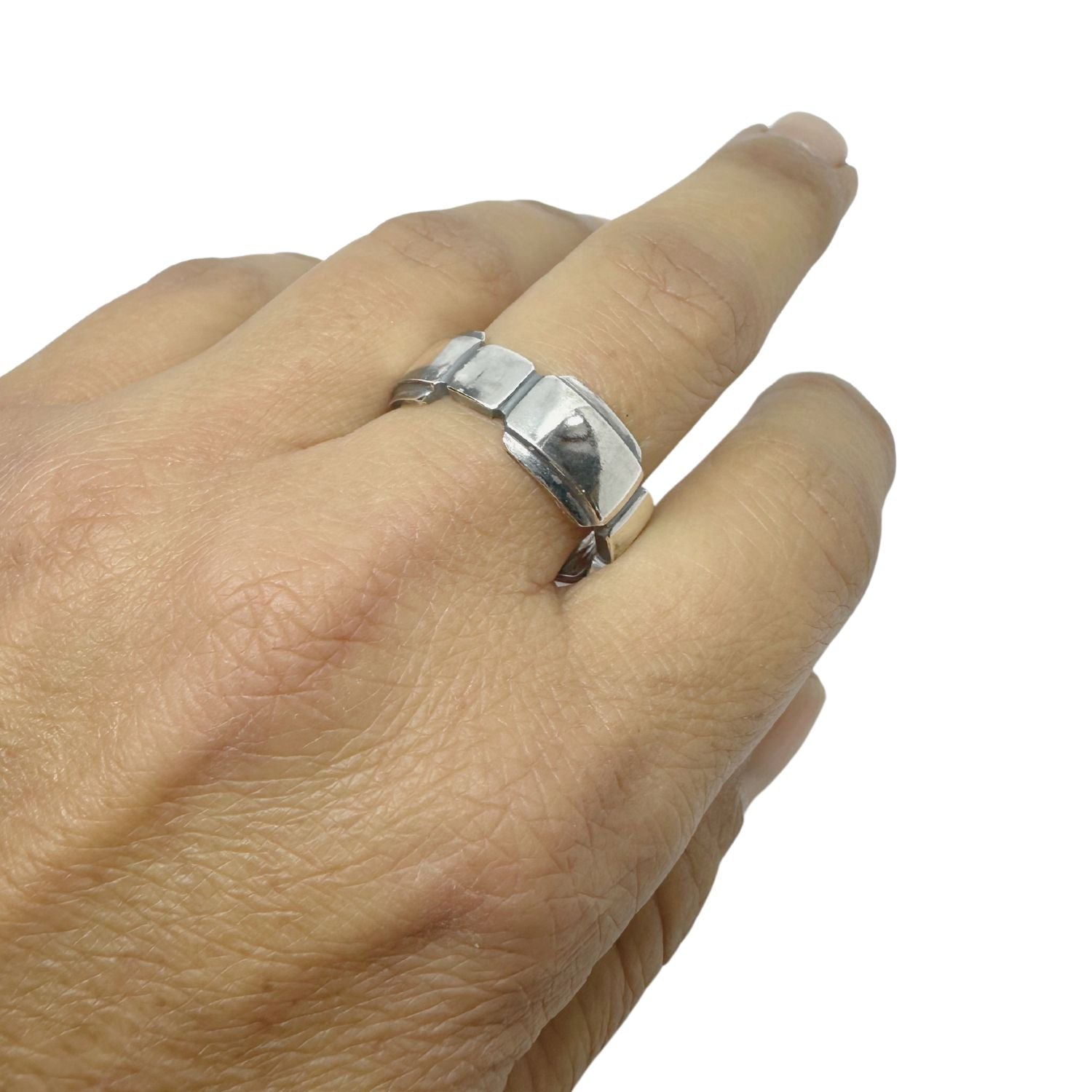 Geometric sterling silver statement ring worn on hand, bold architectural design with polished and darkened recesses — Tg-Jewellery By Tamara Gervasio