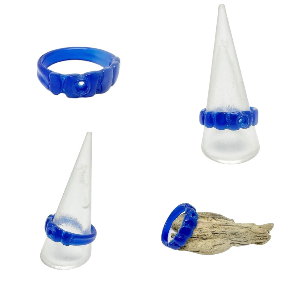 Carved blue wax ring prototype on display cone — handmade jewellery workshop Cornwall