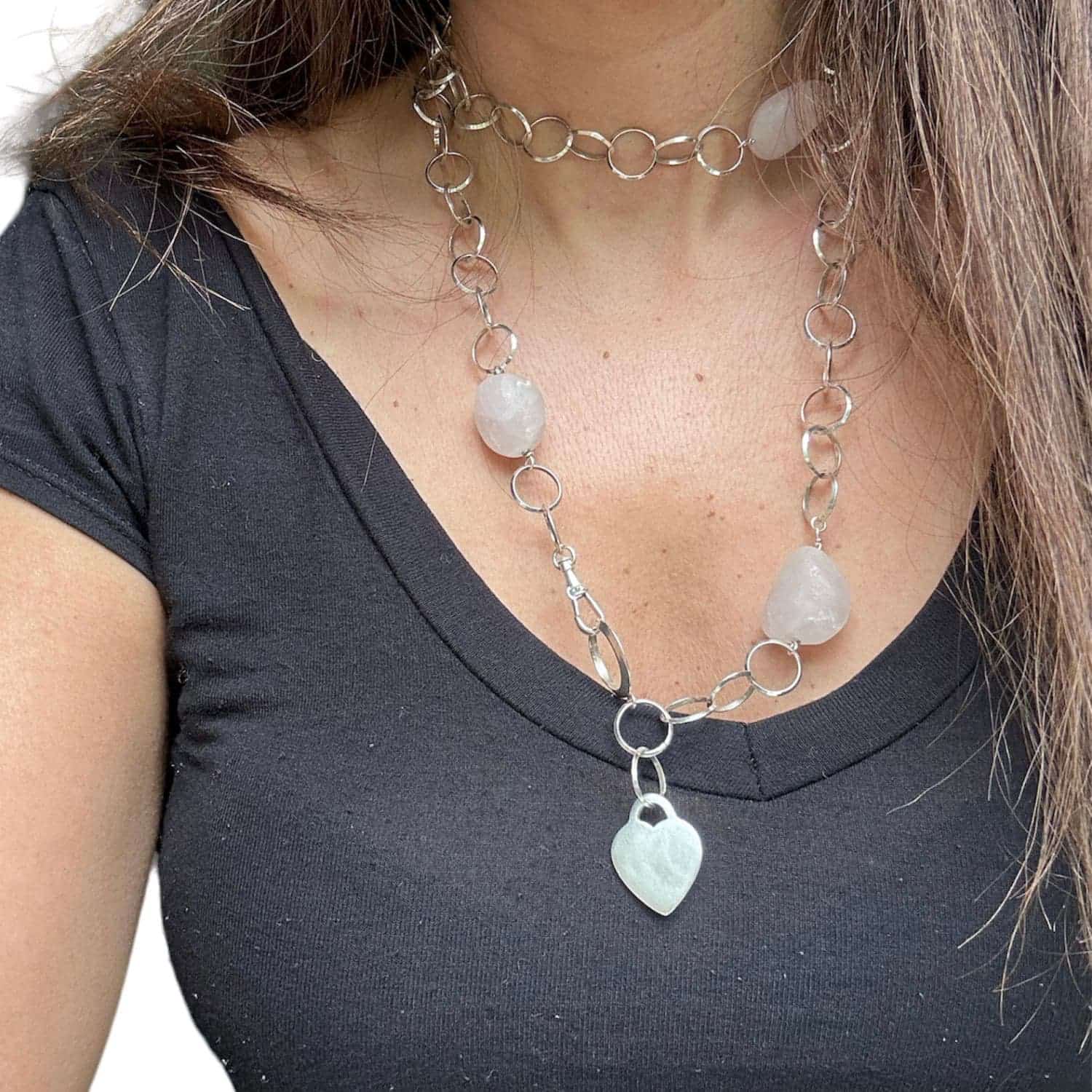 Handcrafted rose quartz and sterling silver heart charm necklace laid flat – TG-Jewellery