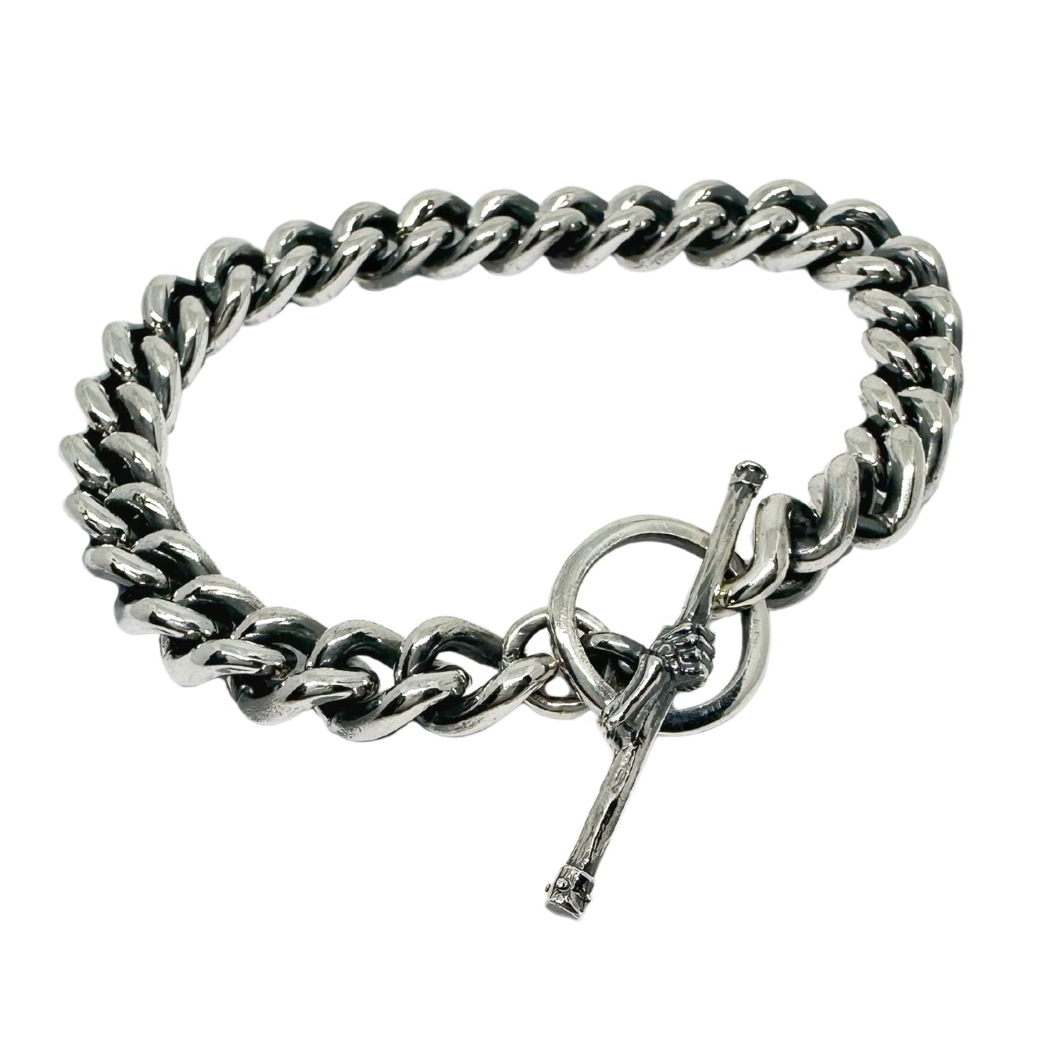 Close-up of lost wax carved skeletal hand T-bar clasp on sterling silver 925 curb chain bracelet – Tg-Jewellery by Tamara Gervasio