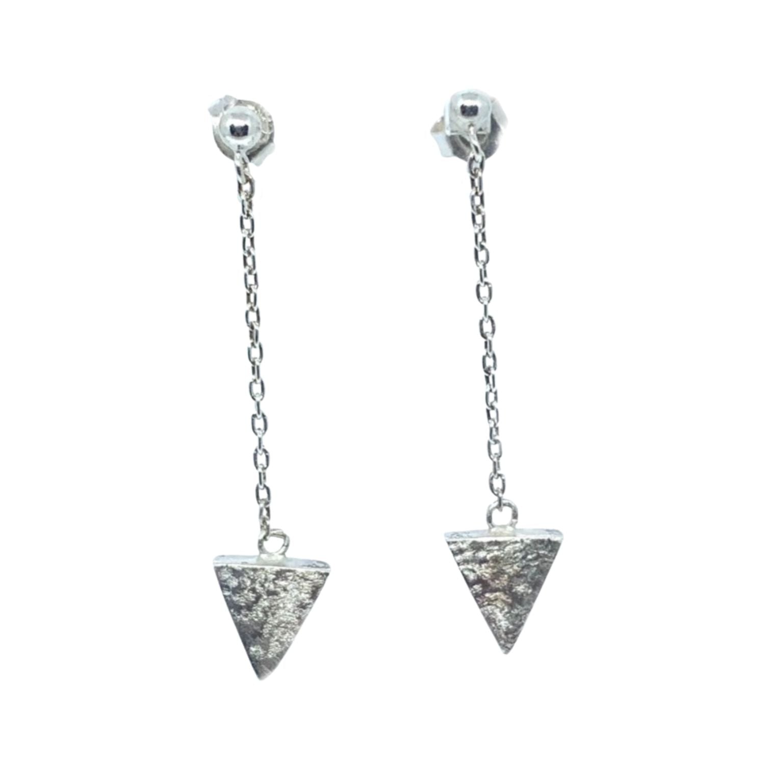 Pair of silver triangle earrings with chain on a white background
