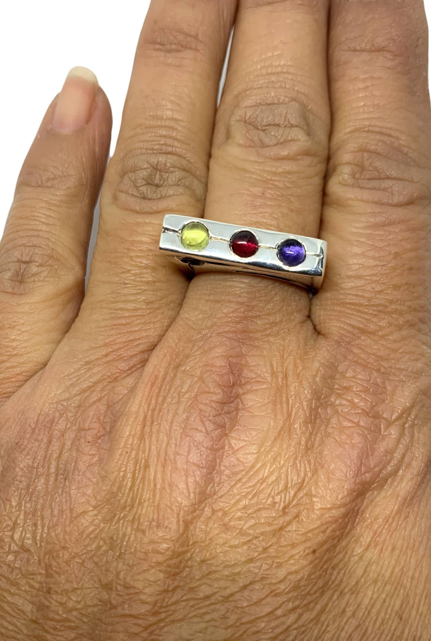 Traffic Light ring worn on hand showing peridot, garnet and blue iolite gemstones – TG-Jewellery