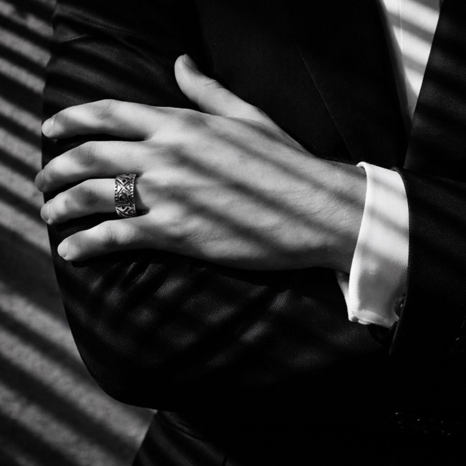 model wearing sterling silver hand carved band with ruby handmade by Tamara Gervasio