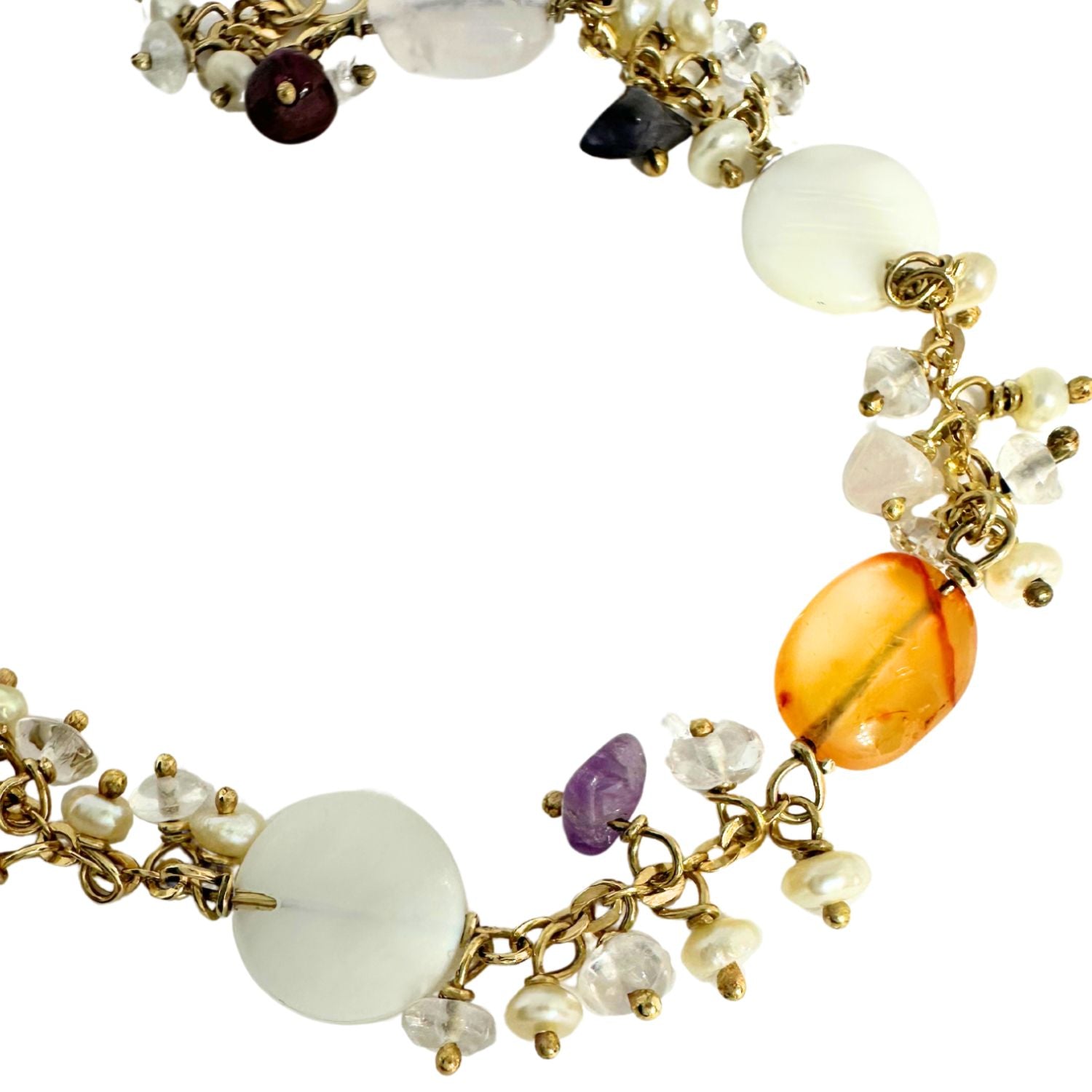 Close-up of natural gemstone mix on 18ct gold bracelet – freshwater pearl, amethyst, carnelian, garnet, peridot and quartz, one of a kind by Tamara Gervasio