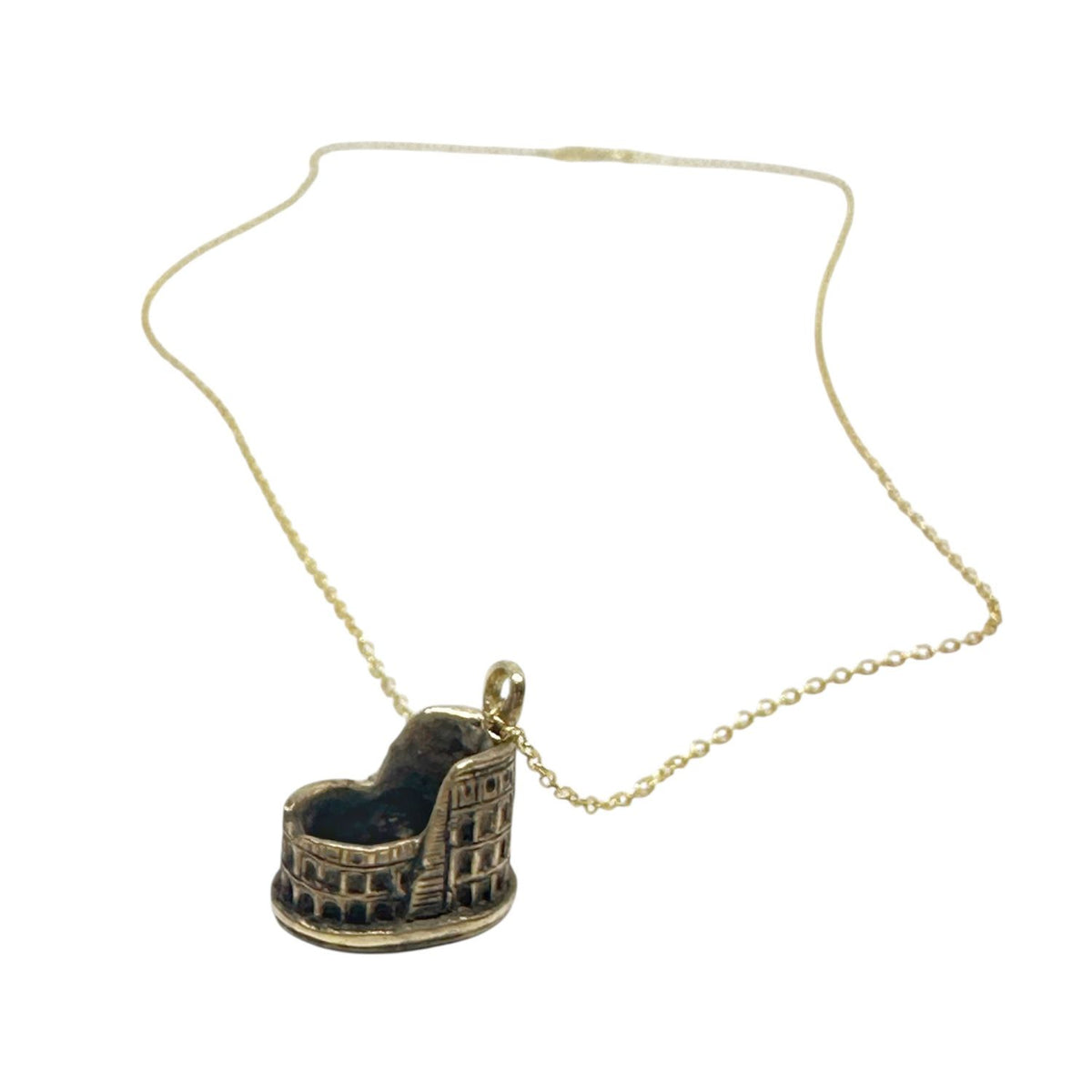 Close-up of Colosseum pendant in 18ct gold flash-plated sterling silver, showing hand-carved architectural detail – Tg-Jewellery by Tamara Gervasio