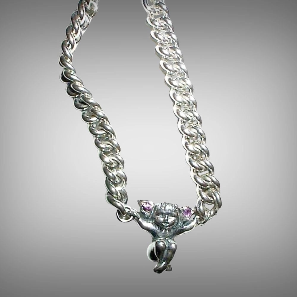 Sterling silver curb chain bracelet featuring a small fairy pendant with small amethyst gemstone, handmade by Tg-Jewellery