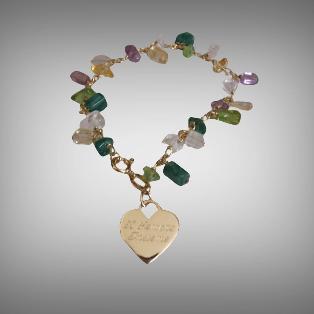 18ct yellow gold charm bracelet featuring a heart-shaped pendant engraved and colorful chips gemstone beads in green, purple, yellow, and white, handmade from recycle gold Tg-jewellery by Tamara Gervasio