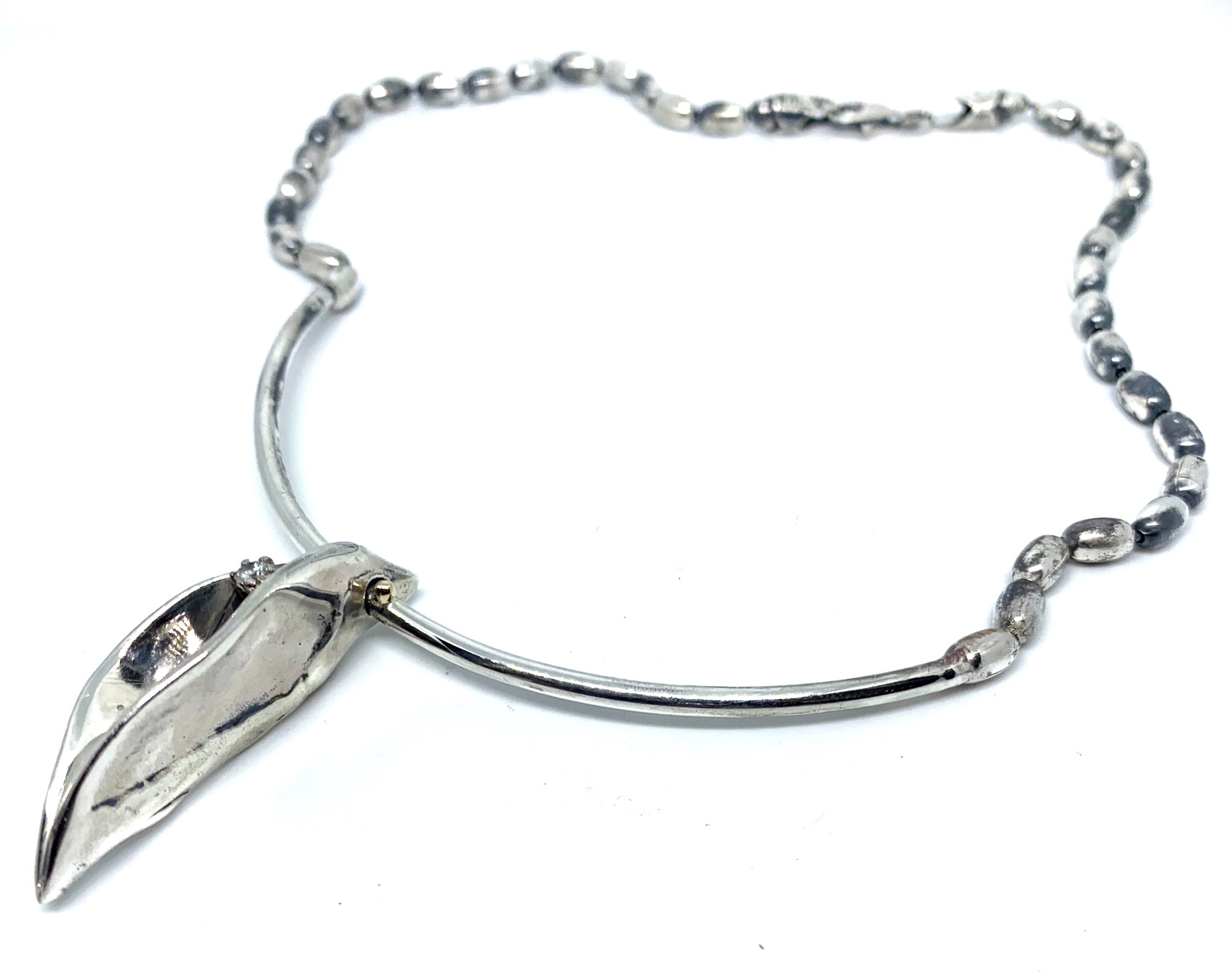 Side profile of Erotika necklace showing pendant depth and oxidised mirror contrast — 36.6cm chain, 27.7g, UK hallmarked- Tg-Jewellery By Tamara Gervasio
