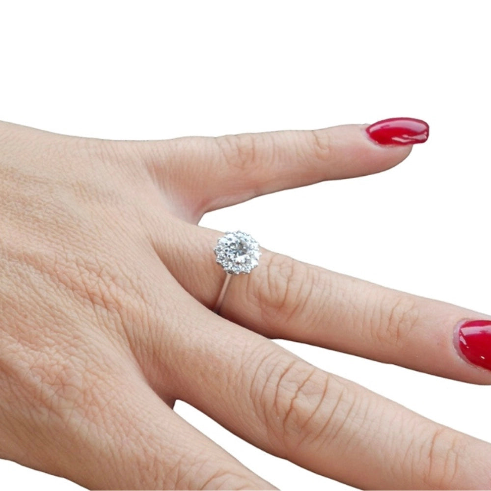 A close-up of a hand wearing a solitaire 18ct white gold band diamonds ring designed by Tamara Gervasio