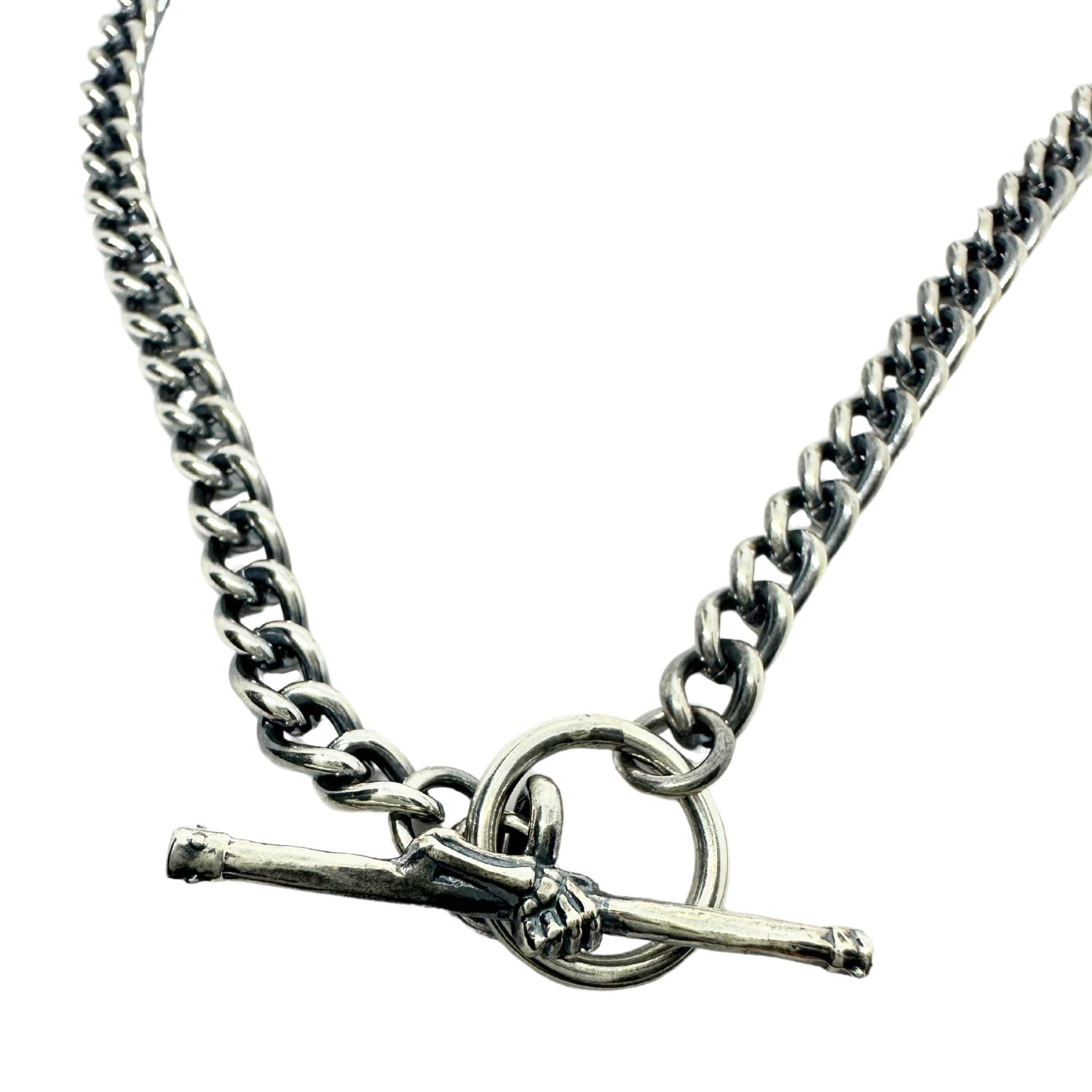 Close-up of lost wax carved skeletal hand T-bar clasp on sterling silver 925 curb chain necklace – Tg-Jewellery by Tamara Gervasio