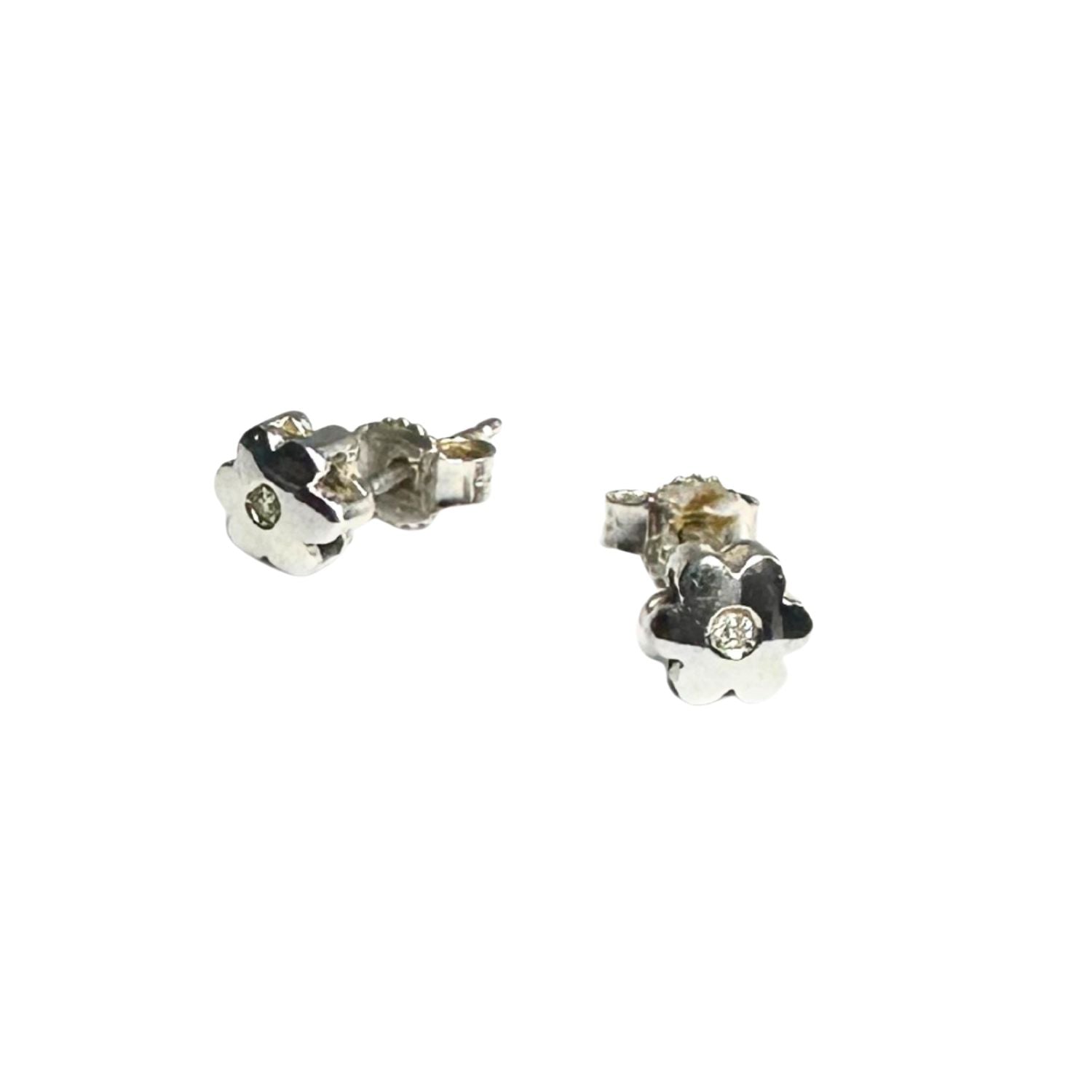 Close-up of natural white diamond floral stud earring in 18ct white gold — 0.03ct per earring, soft continuous sparkle, handmade in Italy