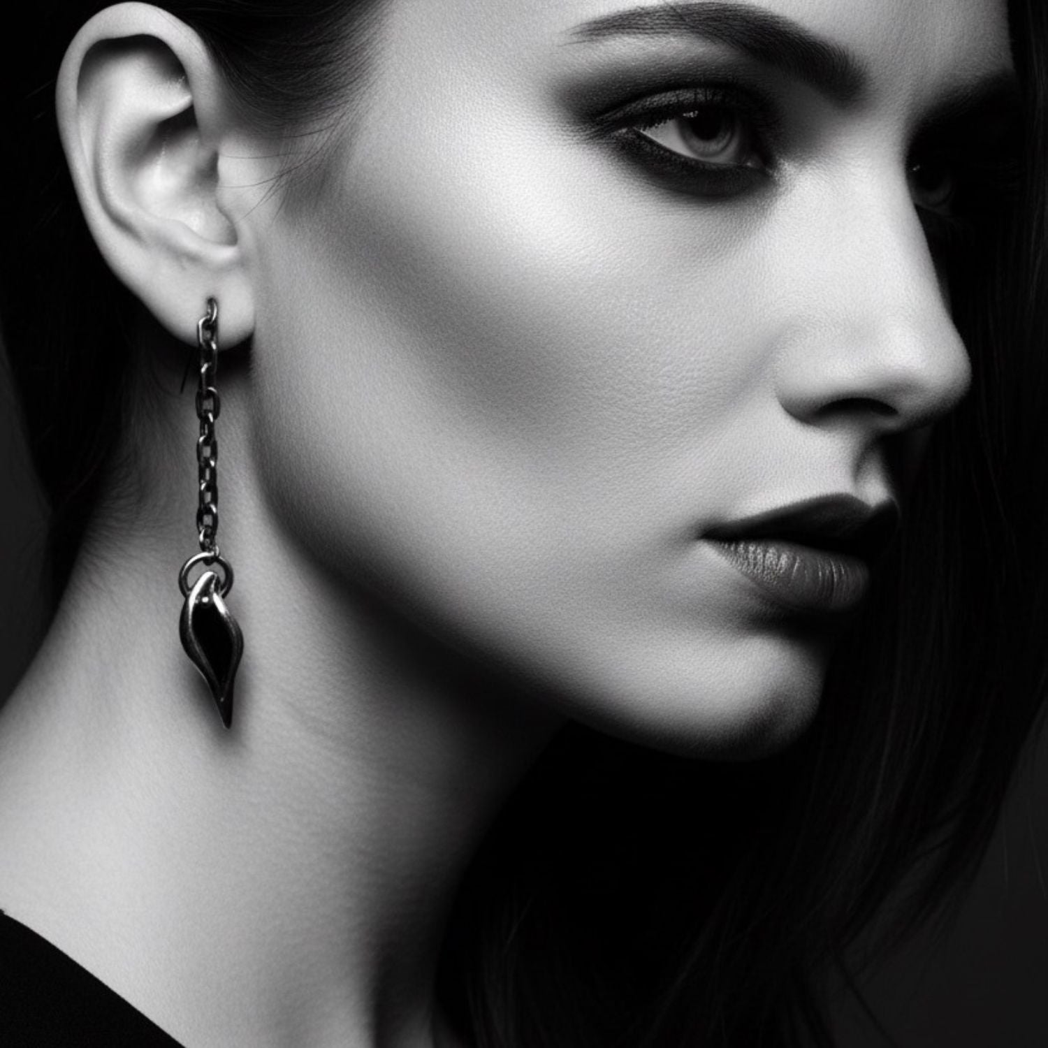 Erotika solo drop earring worn — 5.6cm sterling silver 925 statement earring with 9ct yellow gold detail, handmade in Cornwall
