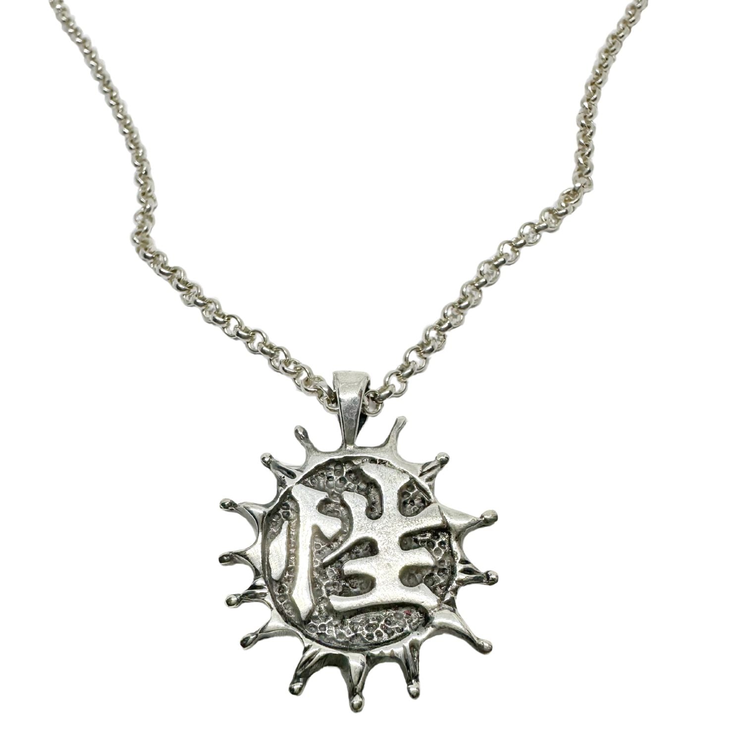 Close-up of Japanese Sex symbol side of dual pendant, lost wax cast sterling silver - Tg-Jewellery By Tamara Gervasio