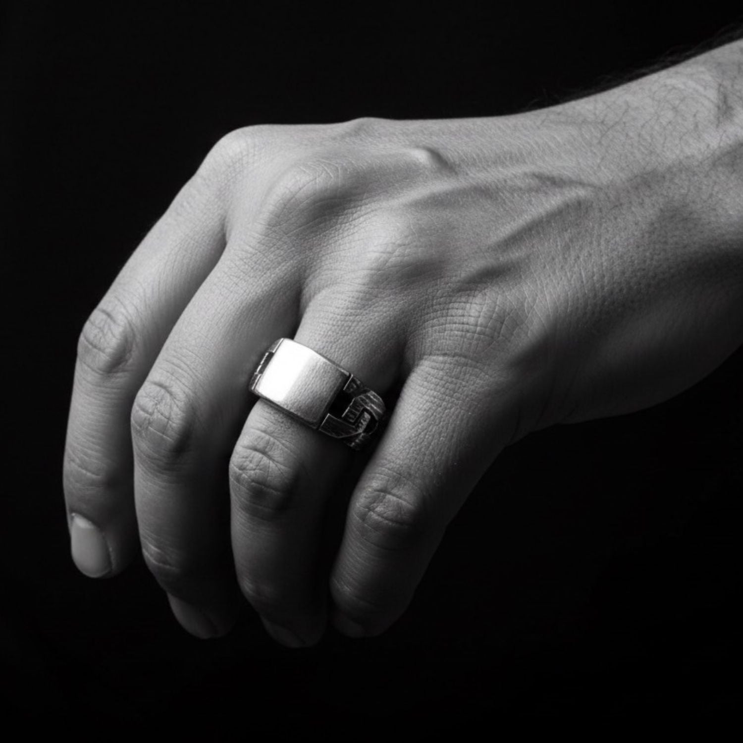 Model wearing sterling silver 925 men's Chain & Plate Ring, bold sculptural chain-link presence on hand