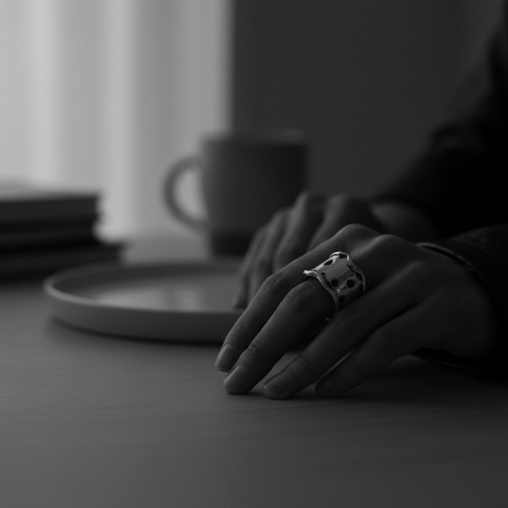 Model wearing sterling silver 925 Plain Chunky Dot Ring, wide band sculptural presence and dotted surface on hand