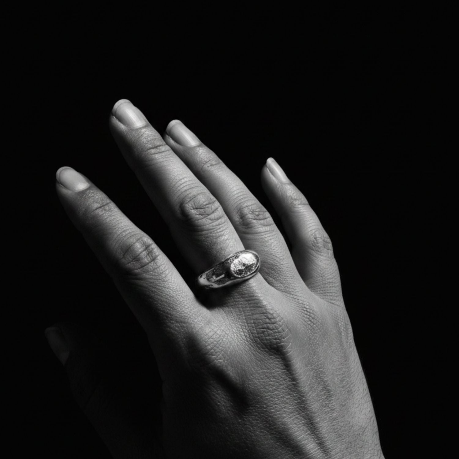 Model wearing recycled sterling silver 925 Ridge Ring, sculptural ridge detail and organic sand-cast texture on hand