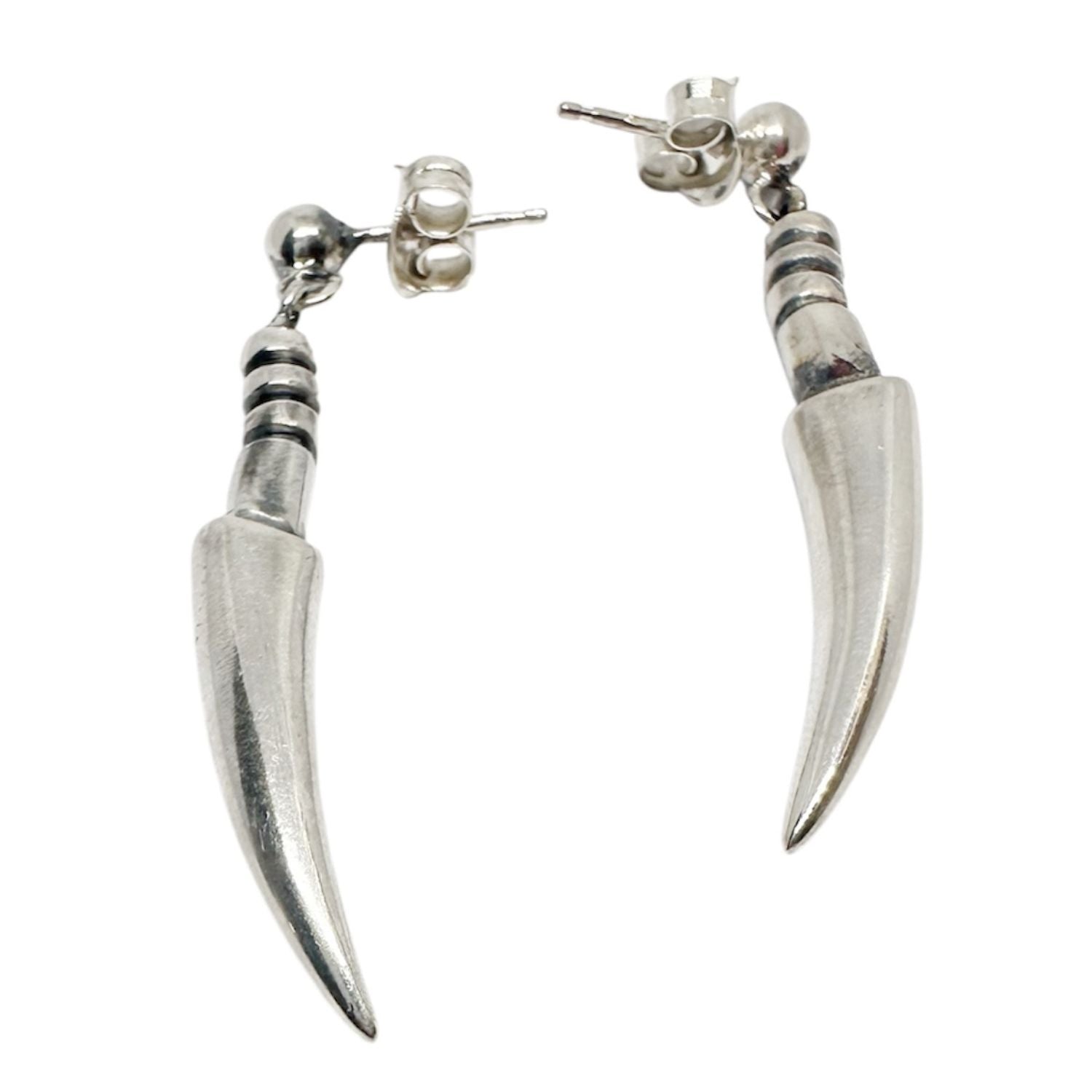 Close-up of spine-inspired sculptural form on Spina sterling silver earrings, organic lost wax cast jewellery