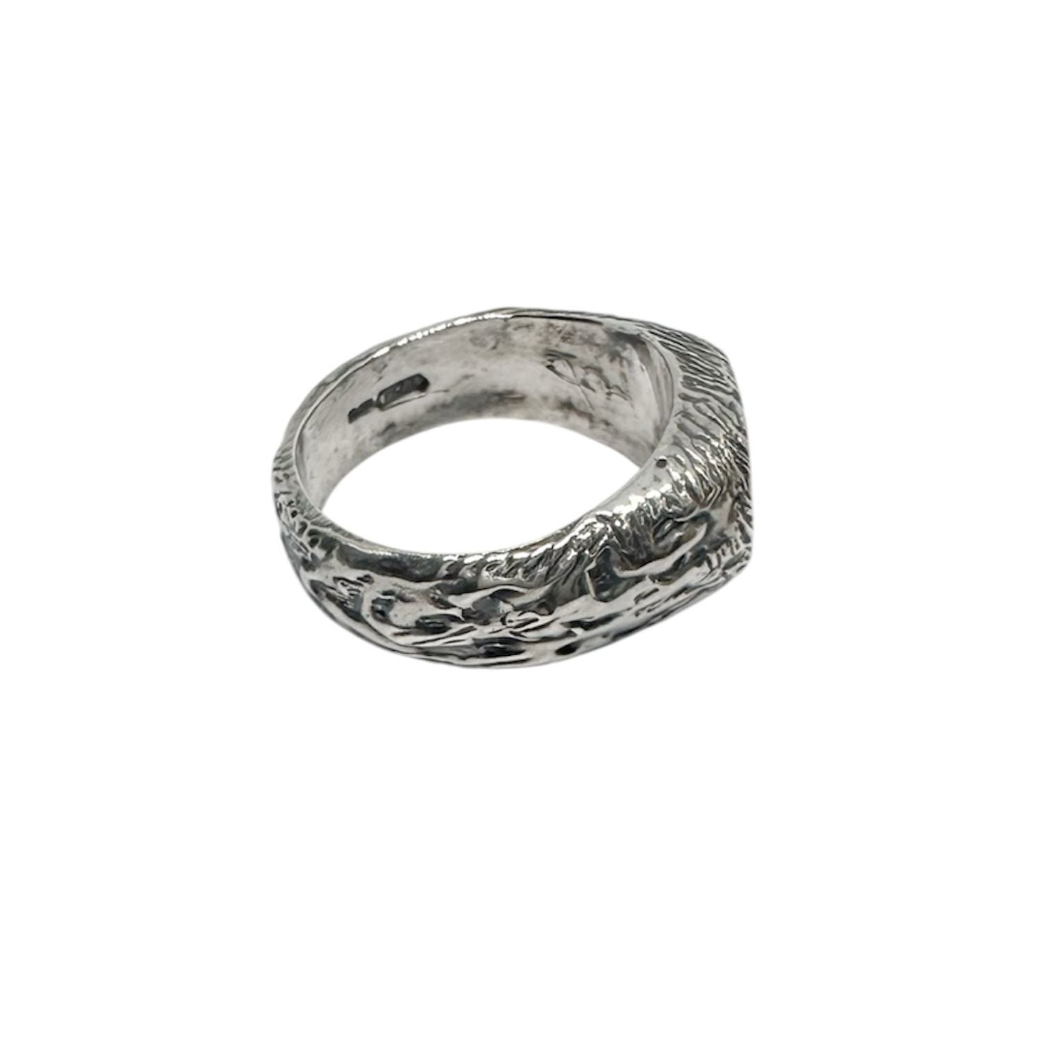 Close-up detail of Strength and Spirit signet ring, sculptural wax-carved texture in sterling silver 925
