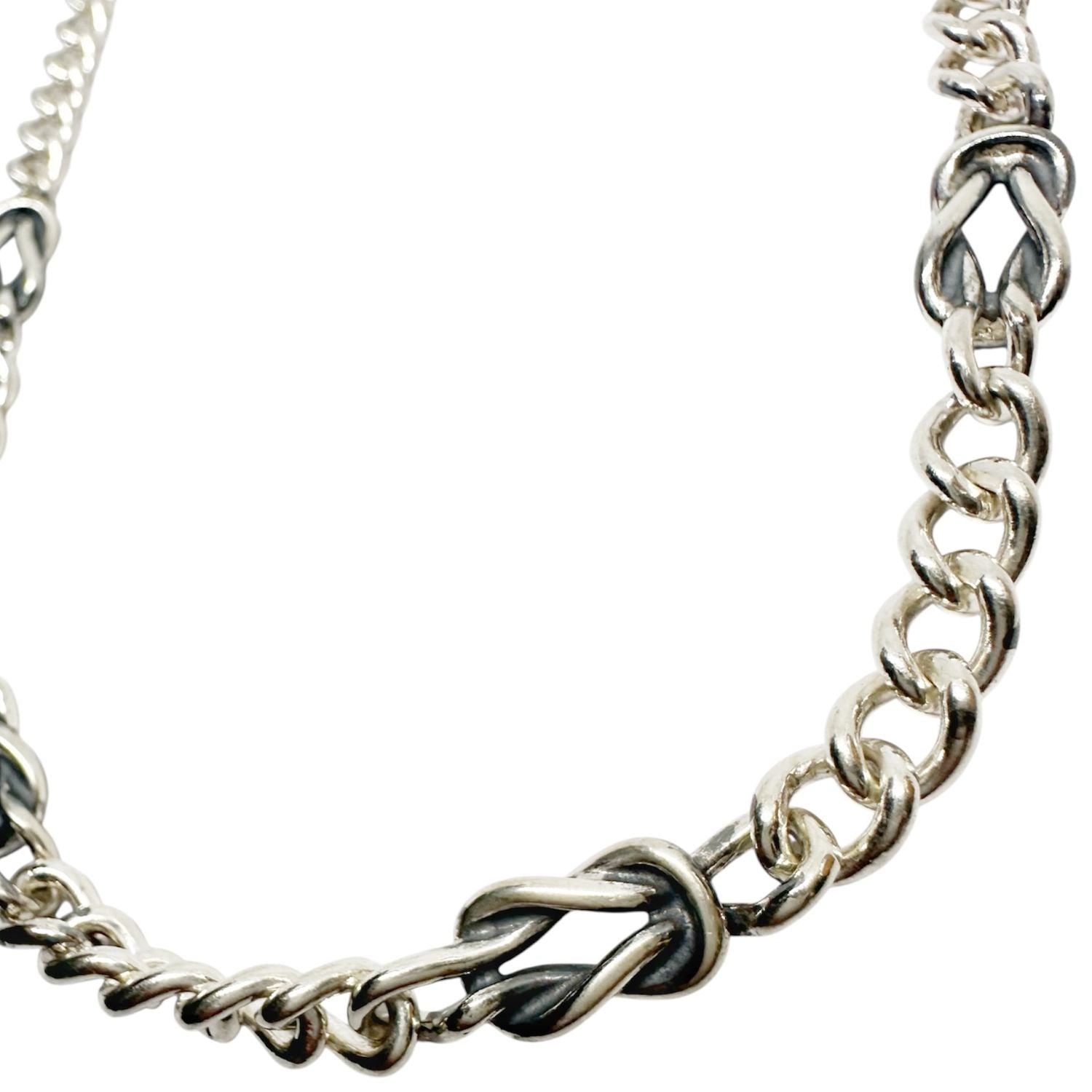 Close-up of sculptural nautical knot link detail in oxidised sterling silver, handmade necklace Tg-Jewellery By Tamara Gervasio